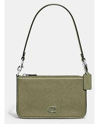 COACH - Pouch Bag With Signature Canvas - Lyst
