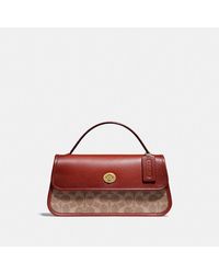 coach clutch price