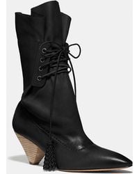 coach lace up tassle boot