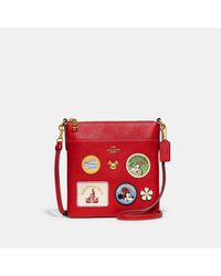 coach aster crossbody with floral frame