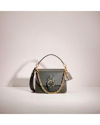 coach beat shoulder bag with rivets