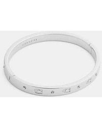 COACH - Repeated C Hinged Bangle - Lyst