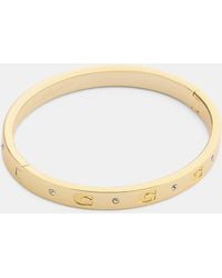 COACH - Repeated C Hinged Bangle - Lyst
