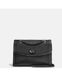 coach parker quilted with rivets