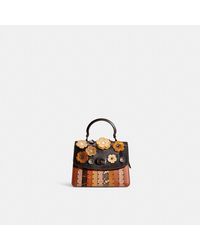 COACH Central Tote In Signature Canvas With Star Applique And Snakeskin Detail in Black Lyst