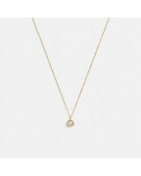 COACH - Collier pendentif rond Halo - Lyst