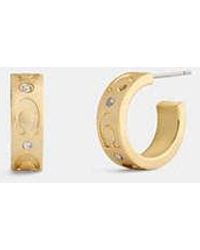 COACH - Repeated C Huggie Earrings - Lyst