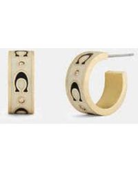 COACH - Repeated C Huggie Earrings - Lyst