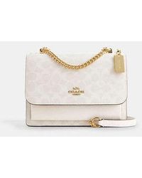 COACH - Bolso cruzado Klare de lona de firma - Lyst