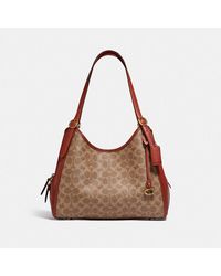 madison shoulder bolsa 16 in signature canvas with rivets