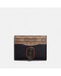 COACH Tarjetero en lona con bloques y parche de firma - Negro