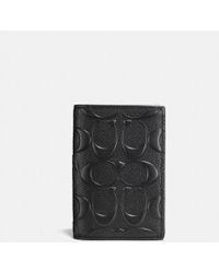 COACH Porta carte di credito bifold in esclusiva pelle trasversale - Nero