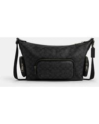 COACH - Bolso Cruzado Finn Con Bolsillos En Lona De Firma - Lyst