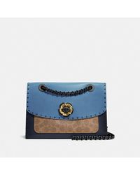 parker in signature canvas with rivets and snakeskin detail