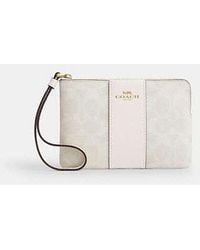 COACH - Corner Zip Wristlet In Signature Canvas With Stripe - Lyst