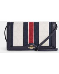 anna foldover clutch crossbody in signature jacquard with stripe