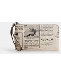 COACH - Large Corner Zip Wristlet With Newspaper Print - Lyst