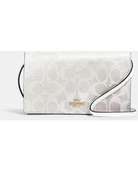 Coach Outlet Anna Foldover Crossbody Clutch In Signature Canvas | Lyst