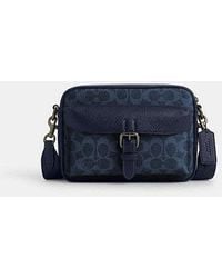 COACH - Warner Crossbody Bag In Signature Canvas - Lyst