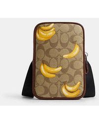COACH - Aden Crossbody In Signature Canvas With Banana Print - Lyst