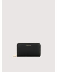 Coccinelle - Large Grainy Leather Zip-Around Purse Metallic Large - Lyst