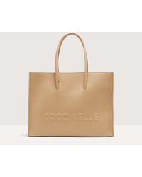 Coccinelle - Grained Leather Handbag Myrtha Maxi Logo Medium - Lyst