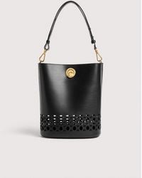 Coccinelle - Smooth Cowhide-Effect Leather Bucket Bag With Broderie Anglaise Monogram Detailing Nikla Medium - Lyst