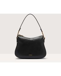 Coccinelle - Grained Leather Shoulder Bag Magie Soft Small - Lyst