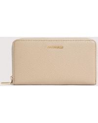 Coccinelle - Large Grainy Leather Zip-Around Purse Metallic Large - Lyst