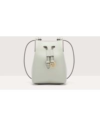 Coccinelle - Cowhide Leather Bucket Bag Roundabout Cowhide Small - Lyst