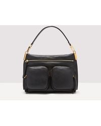 Coccinelle - Grained Leather Handbag Hyle Medium - Lyst