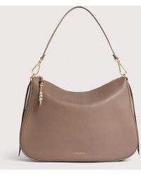 Coccinelle - Grained Leather Hobo Bag Nory Medium - Lyst