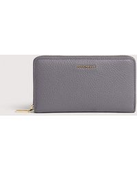 Coccinelle - Large Grainy Leather Zip-Around Purse Metallic Large - Lyst