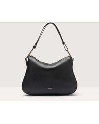 Coccinelle - Grained Leather Shoulder Bag Magie Soft Medium - Lyst