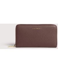 Coccinelle - Large Grainy Leather Zip-Around Purse Metallic Large - Lyst