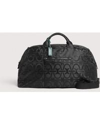 Coccinelle - Reisetasche Aus Nylongewebe Mit Monogram-Muster Smart To Go Monogram Nylon - Lyst