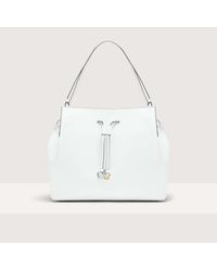 Coccinelle - Borsa shopping in Pelle liscia effetto vacchetta Roundabout Cowhide Large - Lyst