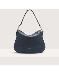 Coccinelle - Grained Leather Shoulder Bag Magie Soft Medium - Lyst