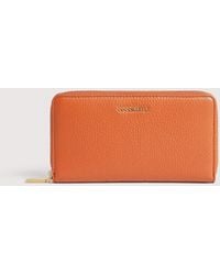 Coccinelle - Large Grainy Leather Zip-Around Purse Metallic Large - Lyst