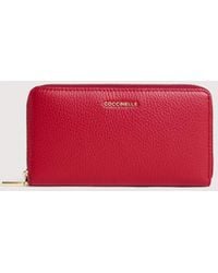 Coccinelle - Large Grainy Leather Zip-Around Purse Metallic Large - Lyst