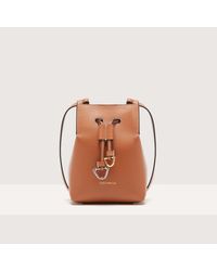 Coccinelle - Cowhide Leather Bucket Bag Roundabout Cowhide Small - Lyst
