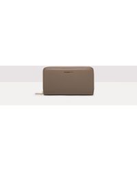 Coccinelle - Große Brieftasche aus genarbtem Leder mit umlaufendem Reißverschluss Metallic Soft - Lyst