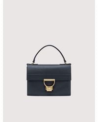 Coccinelle - Grained Leather Clutch Bag Arlettis Mini - Lyst