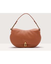 Coccinelle - Grained Leather Handbag Magie Soft Medium - Lyst