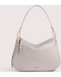 Coccinelle - Grained Leather Hobo Bag Nory Small - Lyst