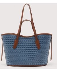 Coccinelle - Shopper Aus Denimblauem, Beschichtetem Canvas Mit Monogram-Muster New Never Without Bag Denim Coated Monogram - Lyst