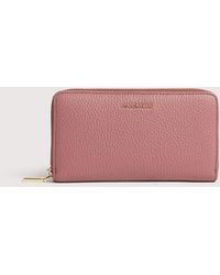 Coccinelle - Large Grainy Leather Zip-Around Purse Metallic Large - Lyst