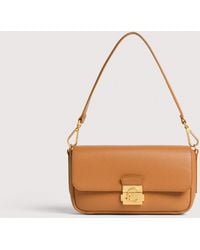 Coccinelle - Grained Leather Shoulder Bag C-Me Lock Medium - Lyst