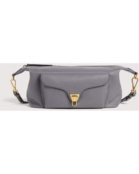 Coccinelle - Grained Leather Crossbody Bag Beat Generation Medium - Lyst