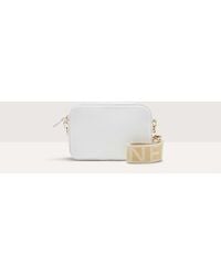 Coccinelle - Grained Leather Crossbody Bag Tebe Small - Lyst